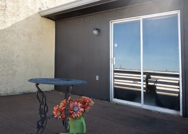 a front view of a house with an outdoor space