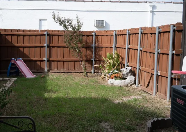 a view of a backyard with potted plants