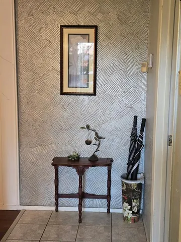 a room with furniture and wooden floor