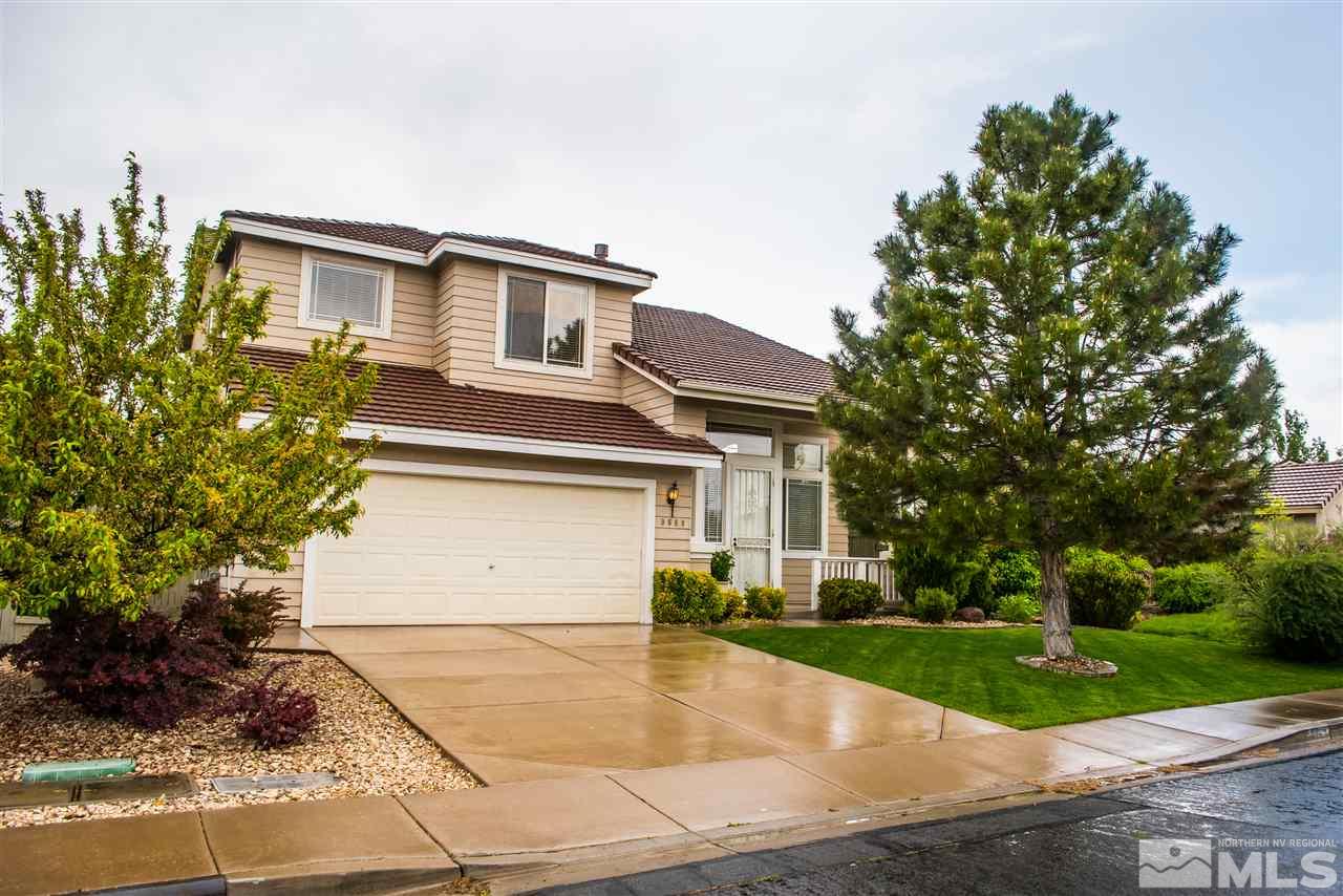 9669 Thunder Mountain Way Reno, NV 89521 - Photo 1 of 1 a view of a white house with a yard and plants