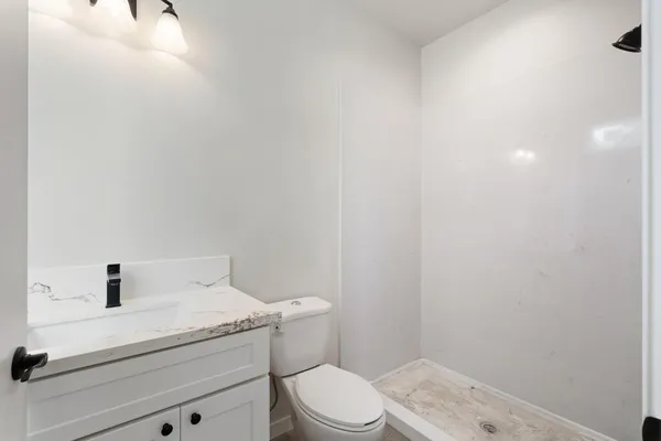 an empty room with closet and window