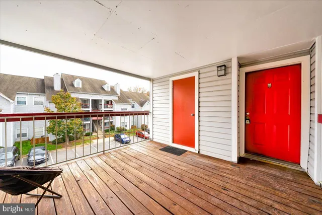 a view of a balcony with wooden floor