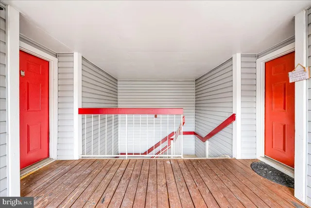 a view of a balcony with wooden floor and stairs