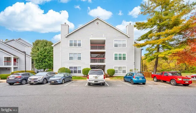 a view of a cars parked in front of a house