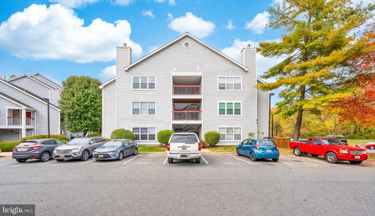 9901 Boysenberry Way, Unit 24018 Gaithersburg, MD 20879 - Photo 2 of 26 a view of a cars parked in front of a house