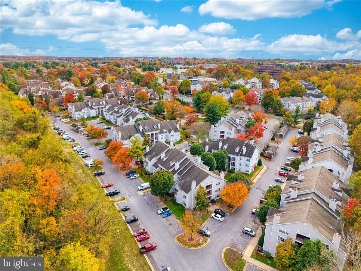 9901 Boysenberry Way, Unit 24018 Gaithersburg, MD 20879 - Photo 23 of 26 an aerial view of residential houses with outdoor space