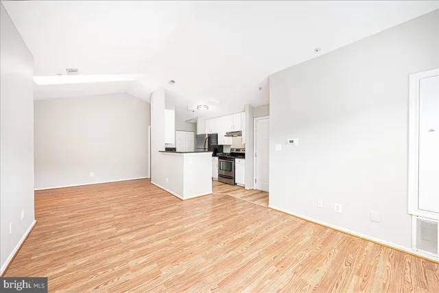 a view of kitchen with wooden floor