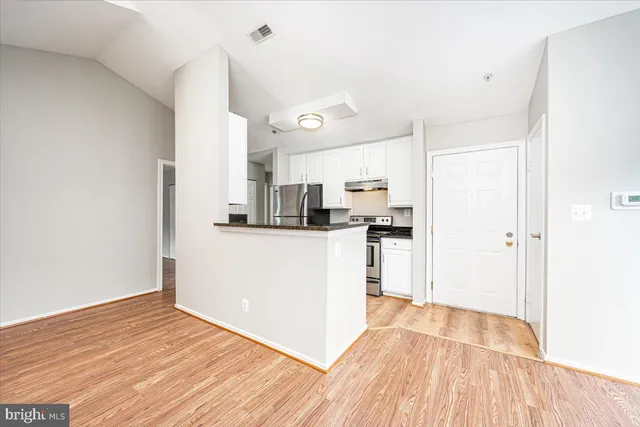 a view of kitchen with wooden floor