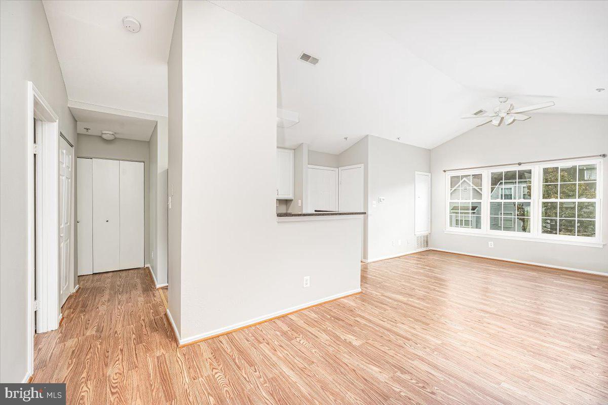 9901 Boysenberry Way, Unit 24018 Gaithersburg, MD 20879 - Photo 8 of 26 a view of empty room with wooden floor and fan