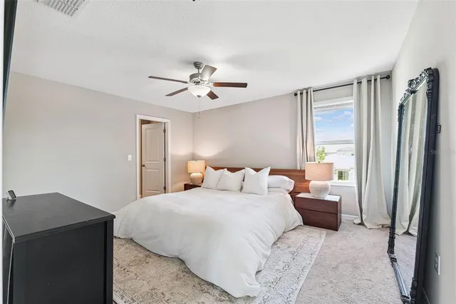 a bedroom with a bed furniture and a window