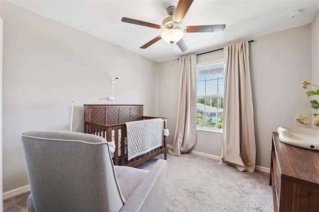 a bed room with a bed and a window