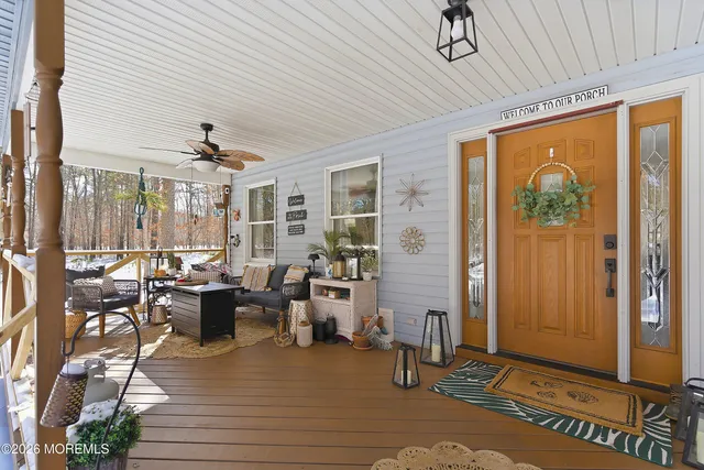 a very nice looking living room with a large window and furniture