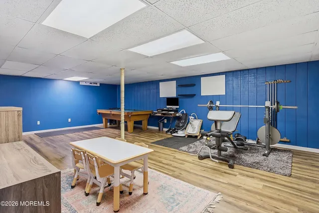 a living room with furniture a table and chairs
