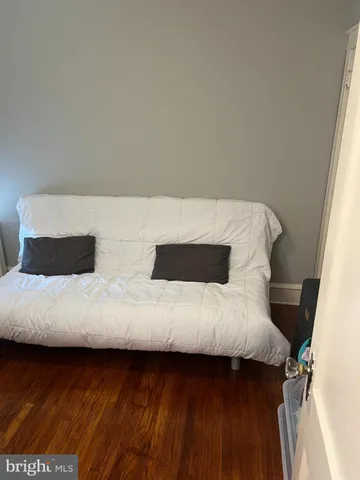 a living room with a bed