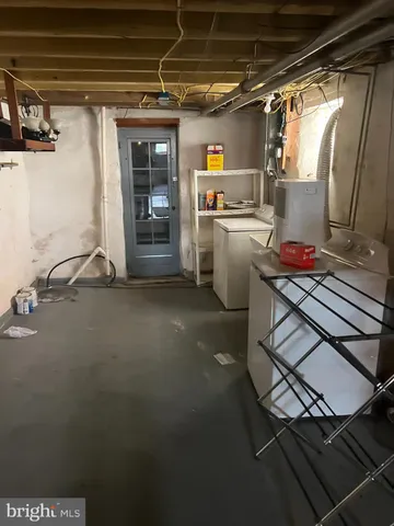 a storage room with washer and dryer