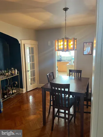 a view of a dining room with furniture and window