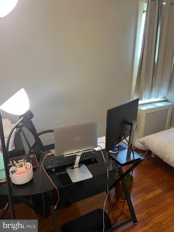 a workspace with furniture and wooden floor