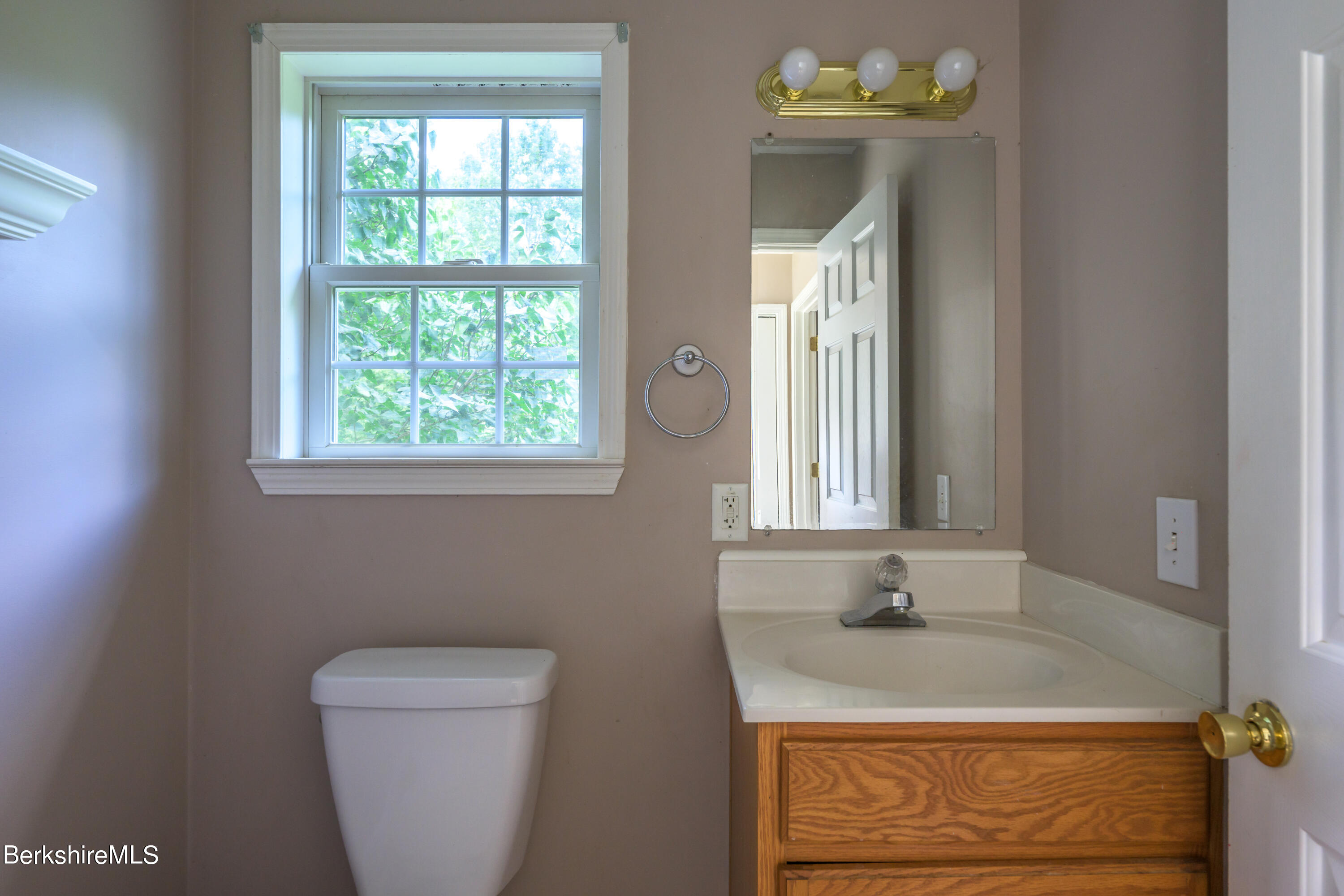 50 Branch Farm Road Richmond, MA 01201 - Photo 20 of 25 a bathroom with a toilet sink and mirror