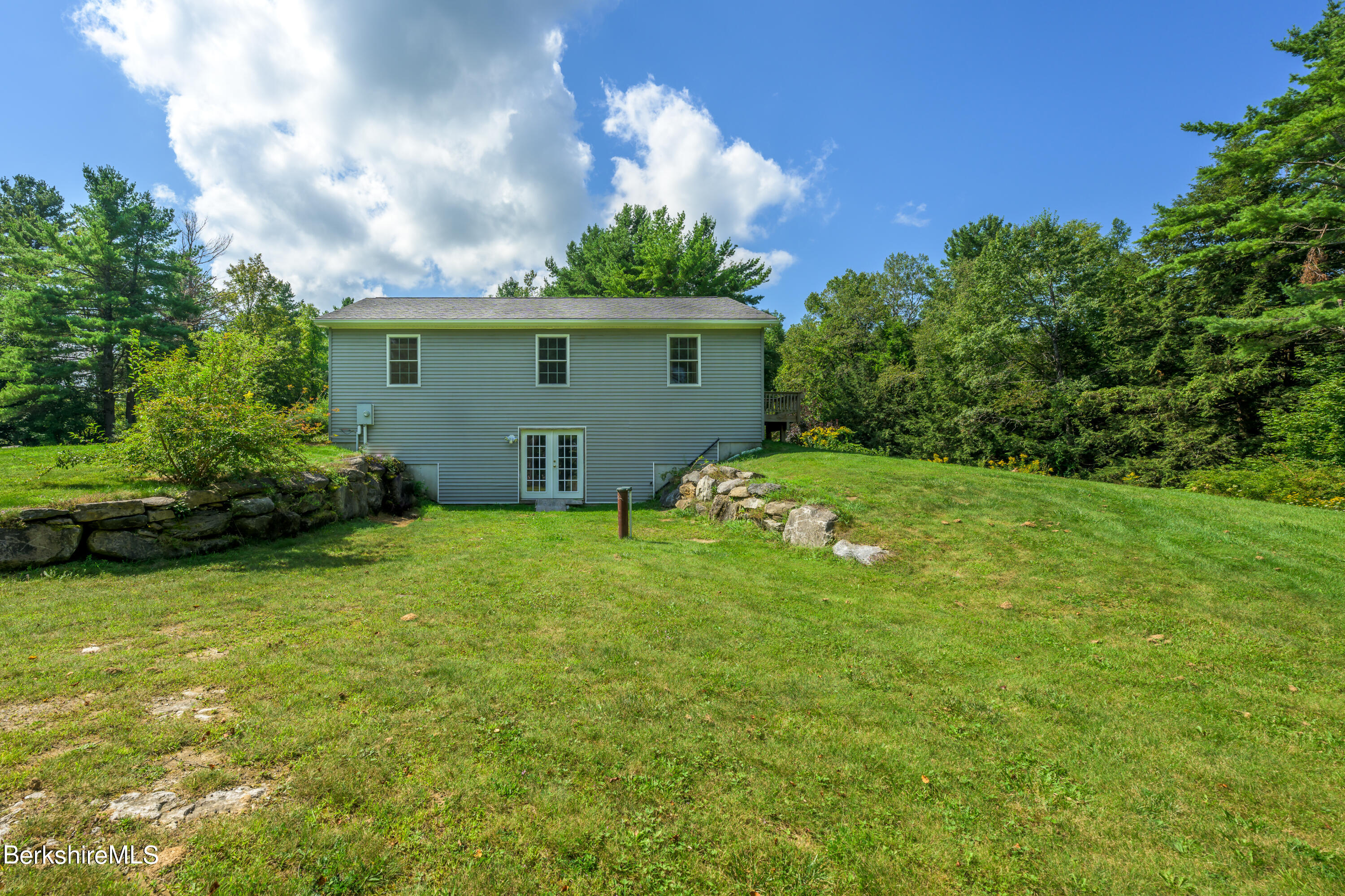 50 Branch Farm Road Richmond, MA 01201 - Photo 21 of 25 a view of a house with a yard
