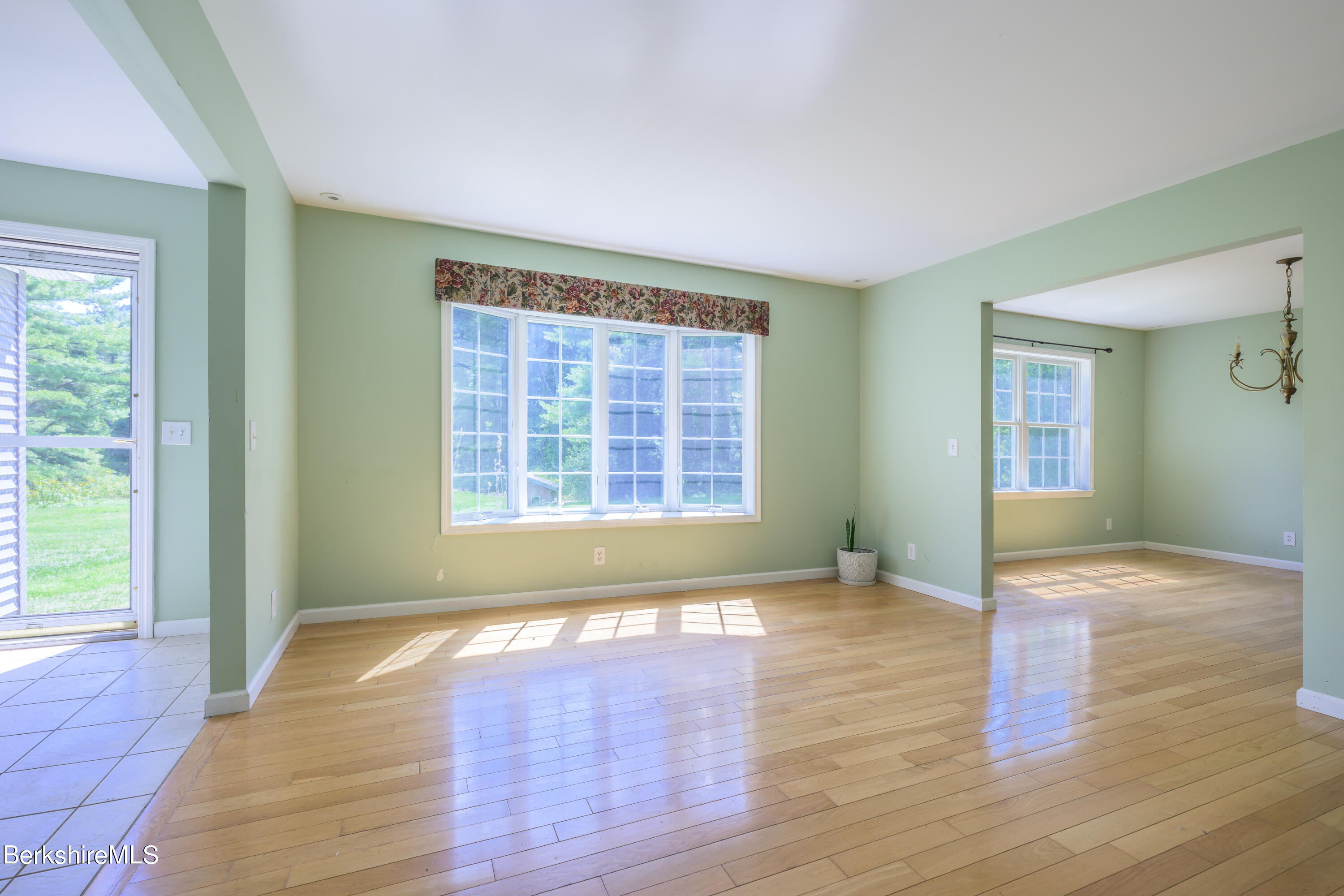 50 Branch Farm Road Richmond, MA 01201 - Photo 5 of 25 a view of an empty room with wooden floor and a window