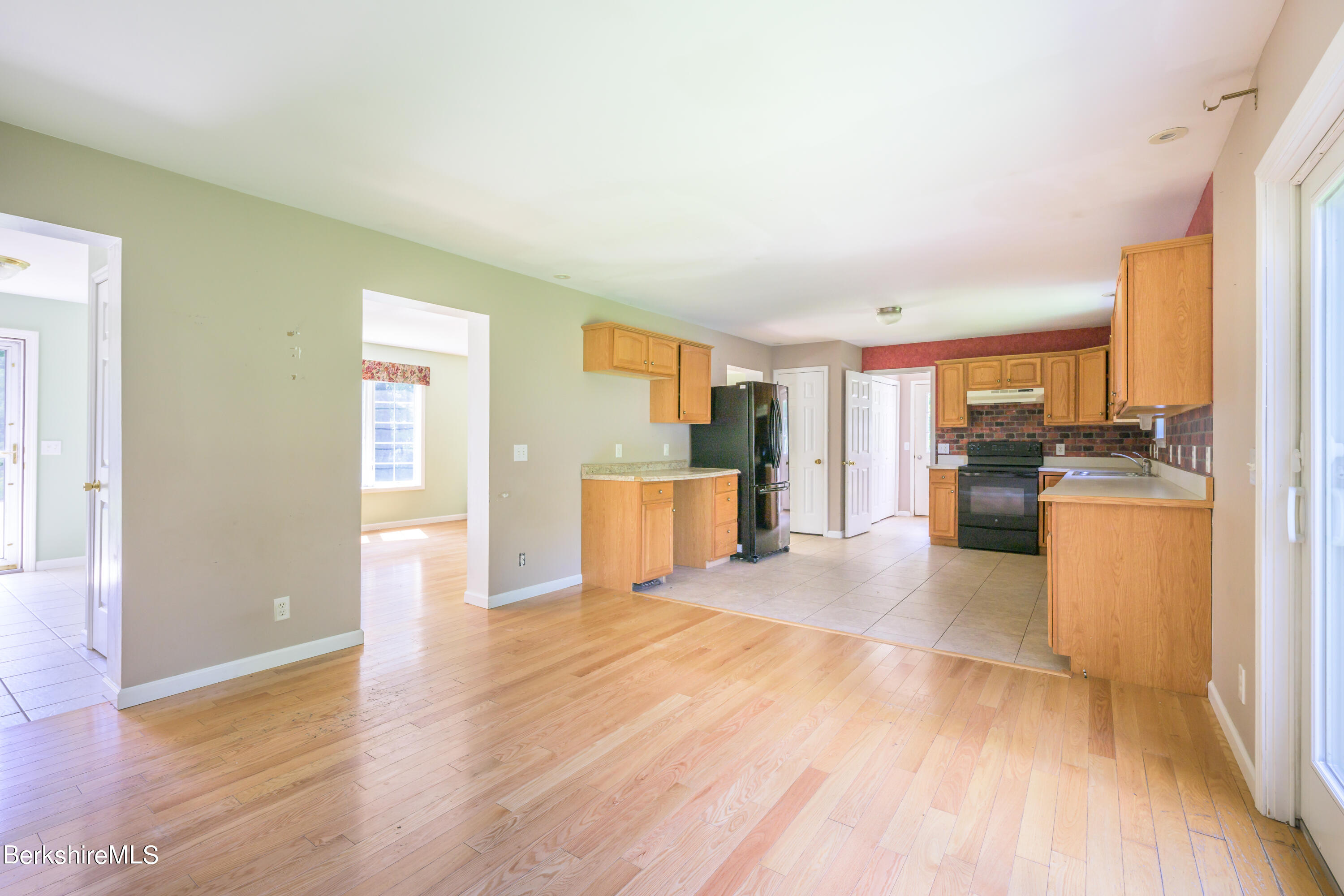 50 Branch Farm Road Richmond, MA 01201 - Photo 8 of 25 a view of a kitchen with kitchen island wooden floors appliances and cabinets