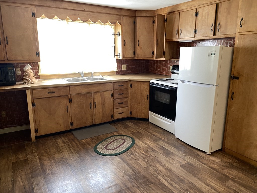 31 Upper Palmer Road Monson, MA 01057 - Photo 12 of 22 a kitchen with a refrigerator sink and cabinets
