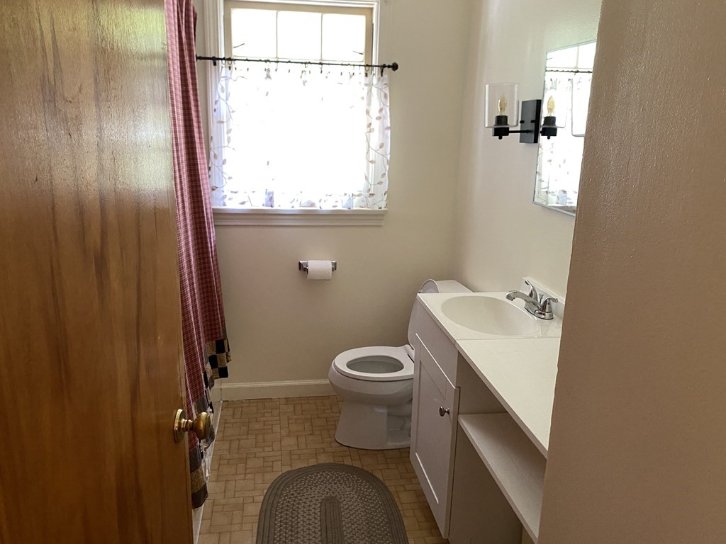 31 Upper Palmer Road Monson, MA 01057 - Photo 8 of 22 a bathroom with a toilet sink and mirror