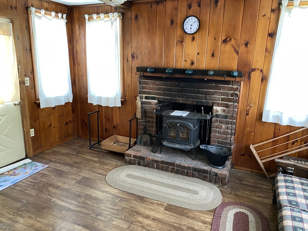 31 Upper Palmer Road Monson, MA 01057 - Photo 10 of 22 a living room with furniture and a fireplace