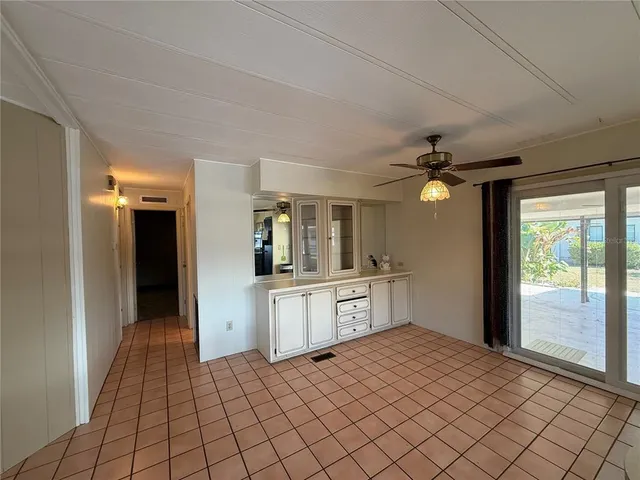a kitchen with a sink cabinets and window