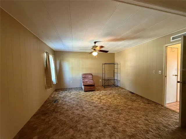 a bathroom with a sink a toilet a mirror and shower