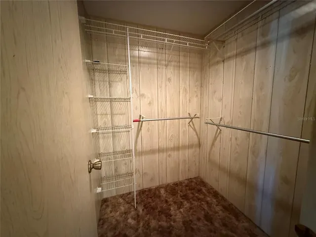 a white toilet sitting next to a window