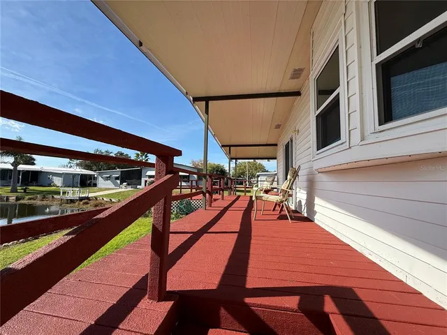 a view of a hallway with closet and cabinet