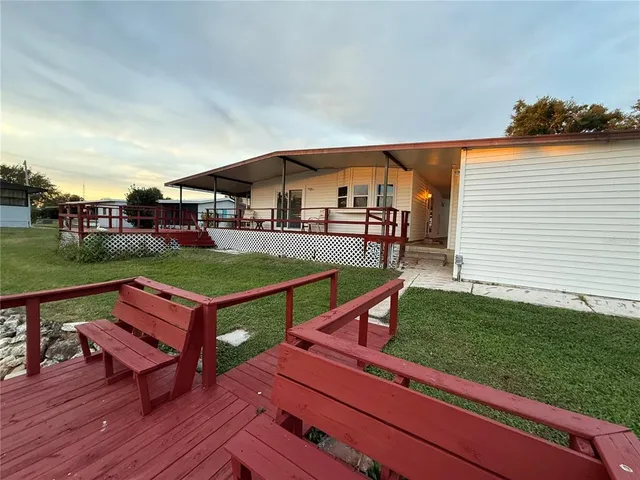 a view of outdoor space with signage and flags