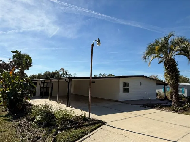 a house view with a backyard space