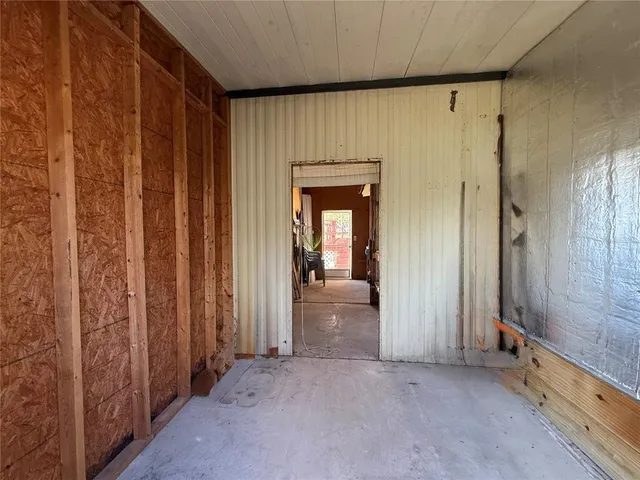 a view of a house with swimming pool and a yard