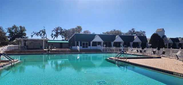 a view of swimming pool with a yard