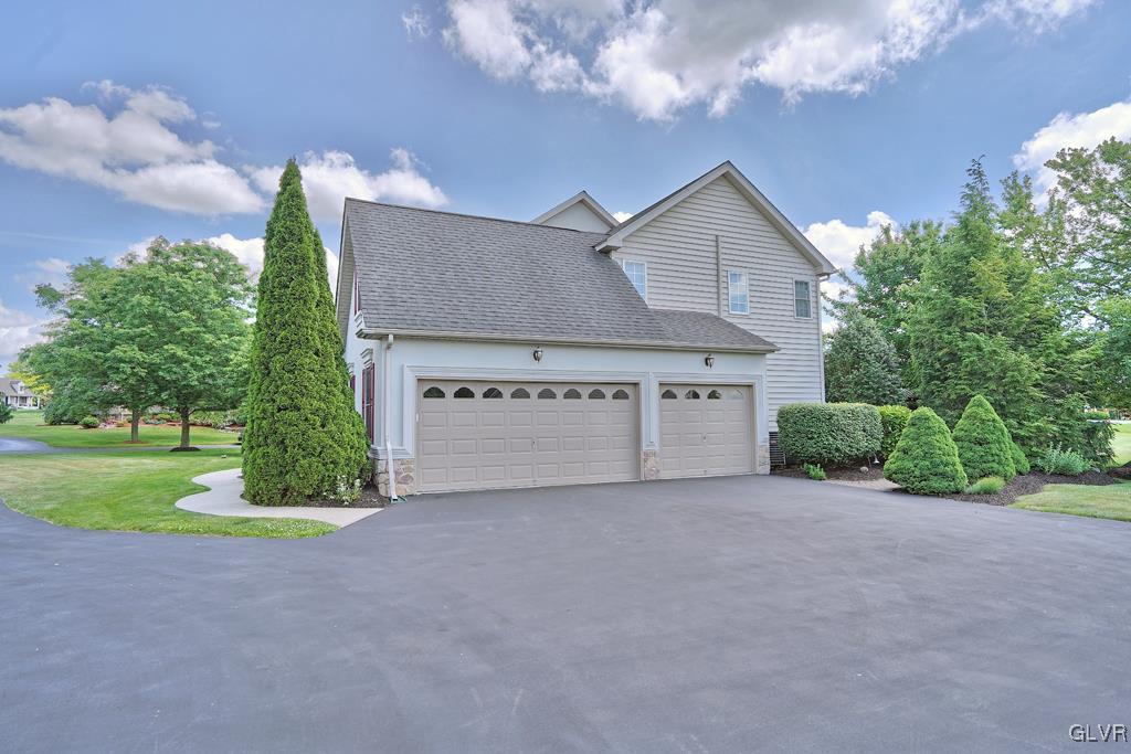 3280 Gun Club Road Nazareth, PA 18064 - Photo 2 of 34 a view of a house with a yard and garage