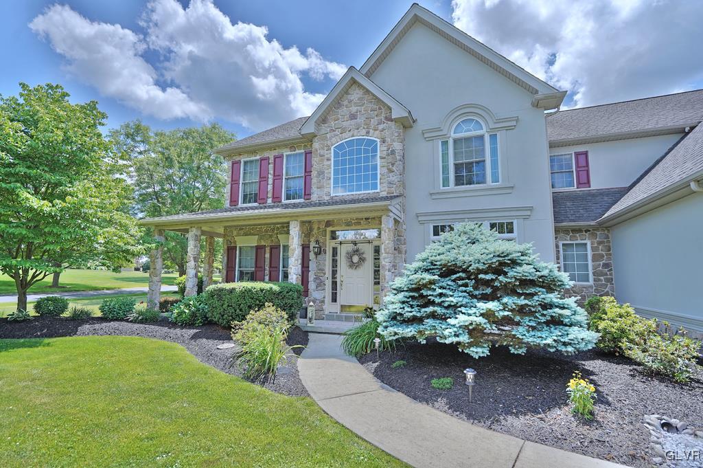 3280 Gun Club Road Nazareth, PA 18064 - Photo 4 of 34 a front view of a house with garden