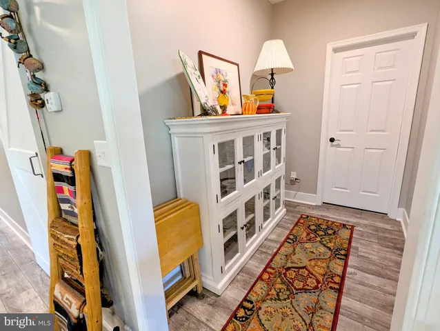 a view of an entryway with wooden floor