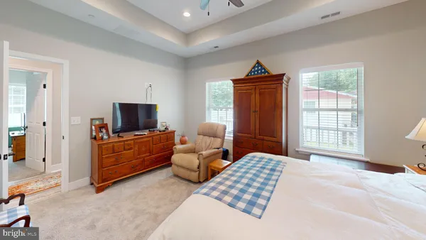 a bedroom with furniture and flat screen tv