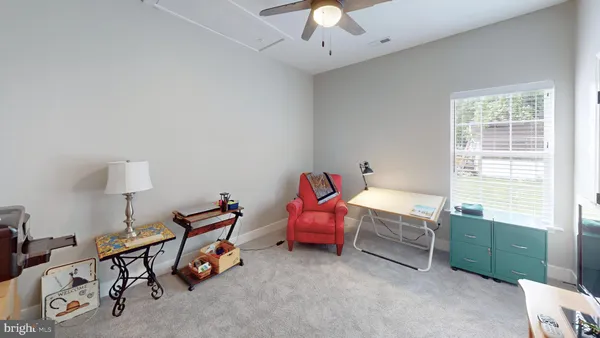 a view of a livingroom with furniture and windows