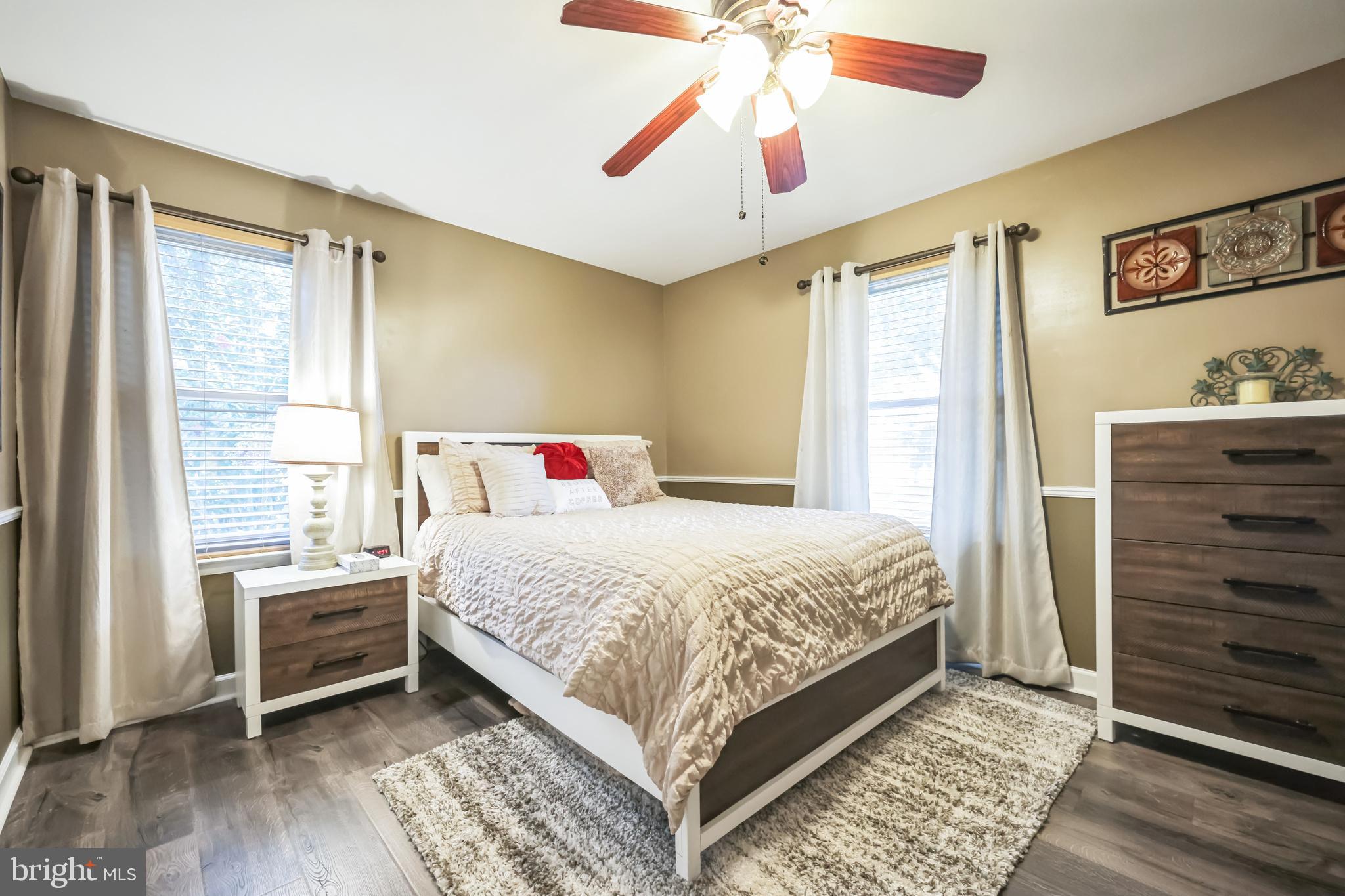 550 Sherry Drive Runnemede, NJ 08078 - Photo 13 of 28 a bedroom with a bed and a chandelier