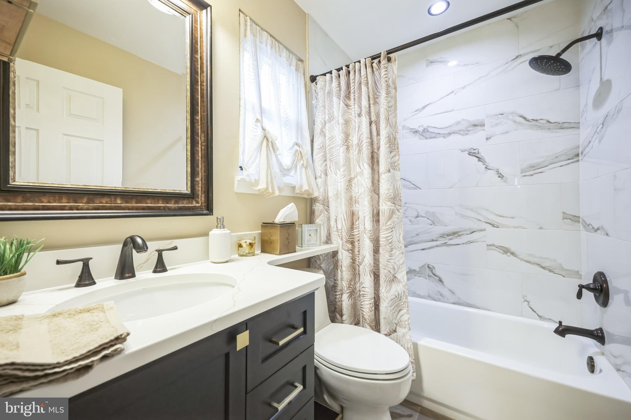 550 Sherry Drive Runnemede, NJ 08078 - Photo 17 of 28 a bathroom with a sink toilet and shower