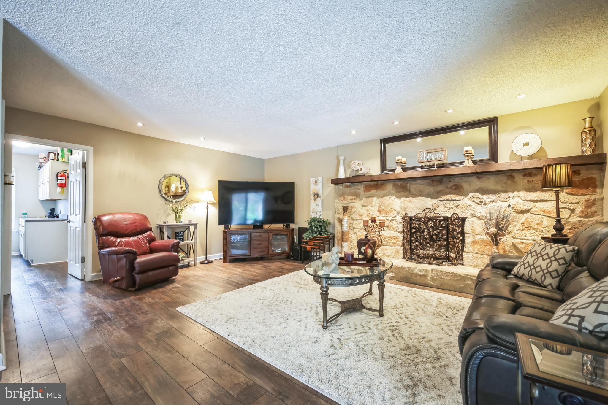 550 Sherry Drive Runnemede, NJ 08078 - Photo 6 of 28 a living room with furniture and a fireplace