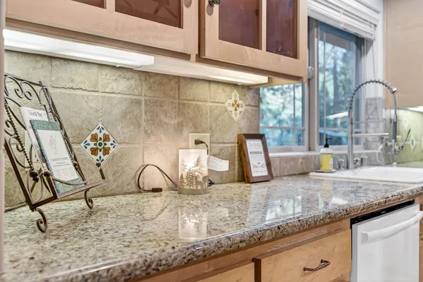 a kitchen with a stove and a refrigerator