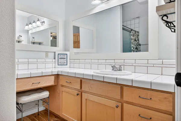 a view of a patio with a table and chairs