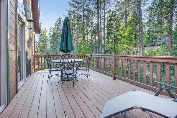 a view of a house with a deck and a patio