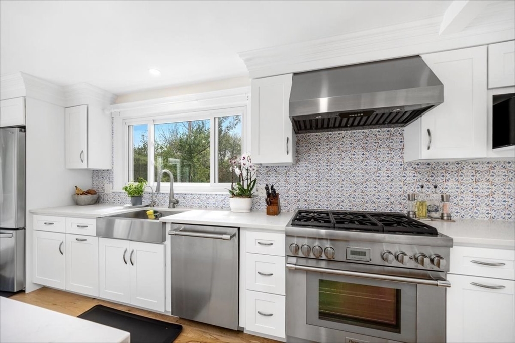4 Cushing Street Hingham, MA 02043 - Photo 1 of 1 a kitchen with white cabinets and white appliances