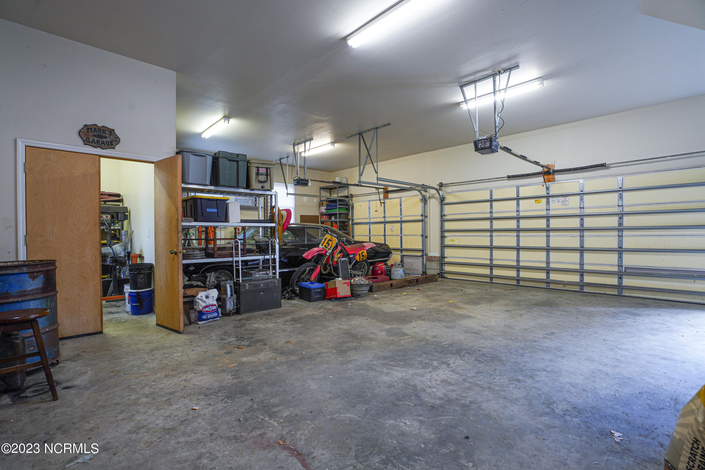 203 Willbarry Road Jacksonville, NC 28540 - Photo 7 of 62 Garage bays with entry to heated/cooled workspace