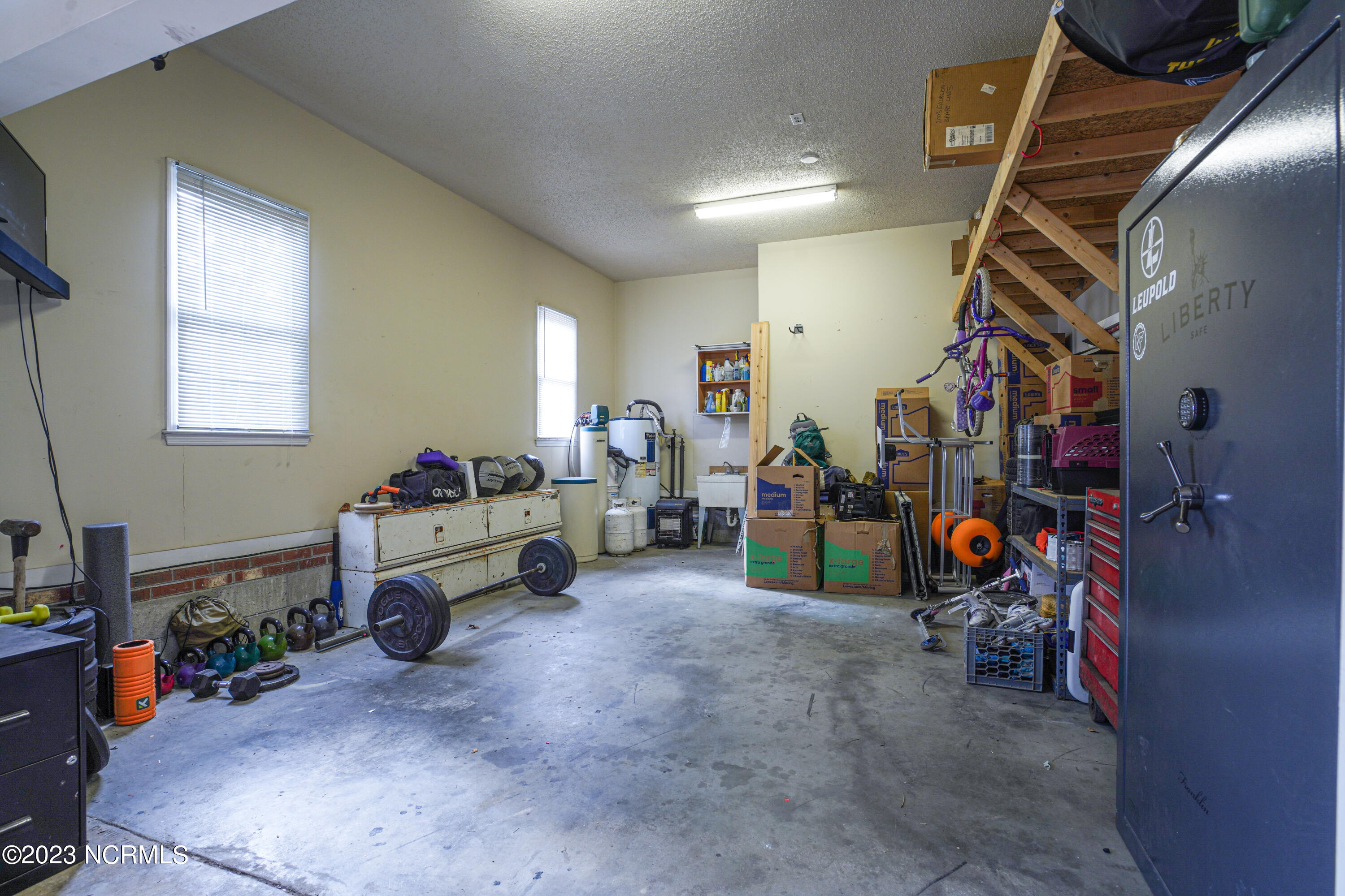 203 Willbarry Road Jacksonville, NC 28540 - Photo 9 of 62 Off of main garage, extra bay and/or workout space with safe